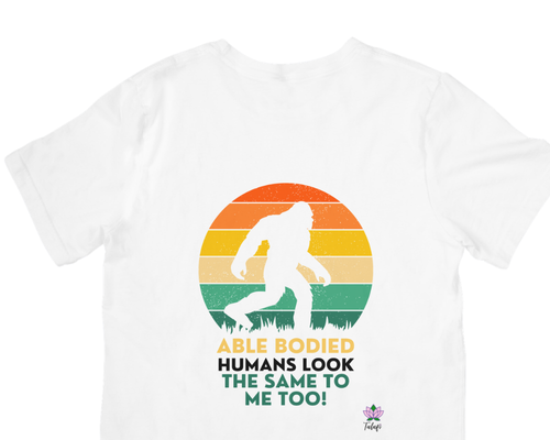White T-shirt with Bigfoot graphic and message encouraging equal treatment of people with disabilities.